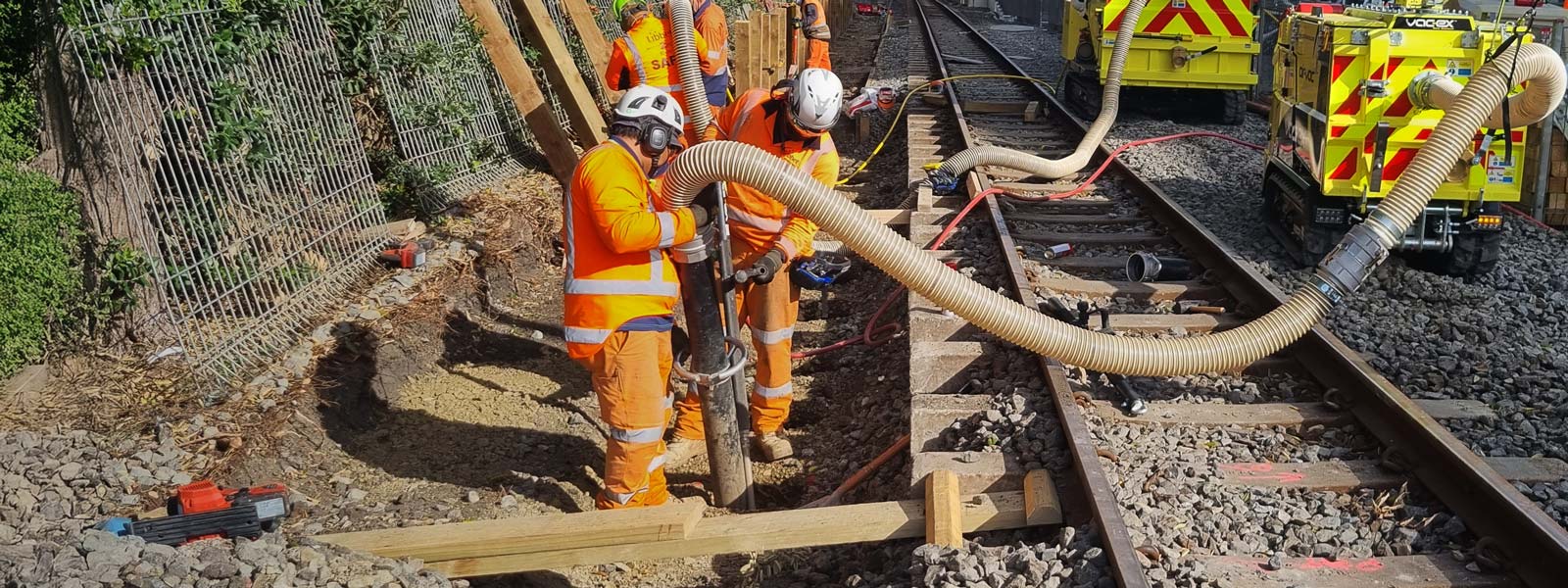 Photo showing railway workers using Vac-Ex system